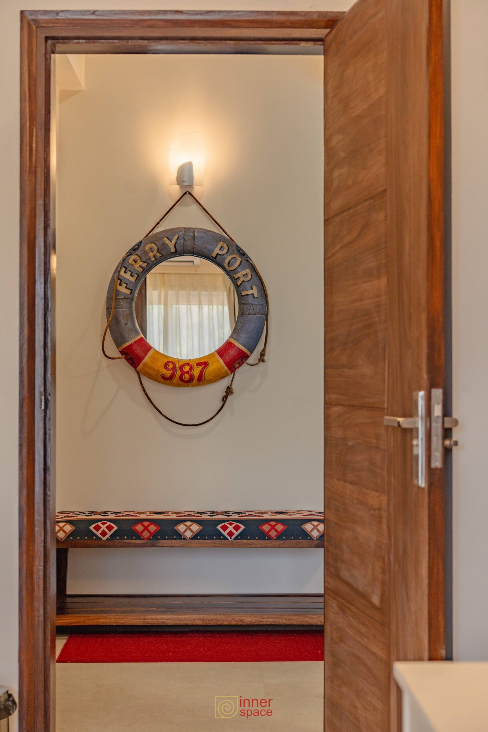 unique airbnb in goa interior design. Open door leads to a hallway wi